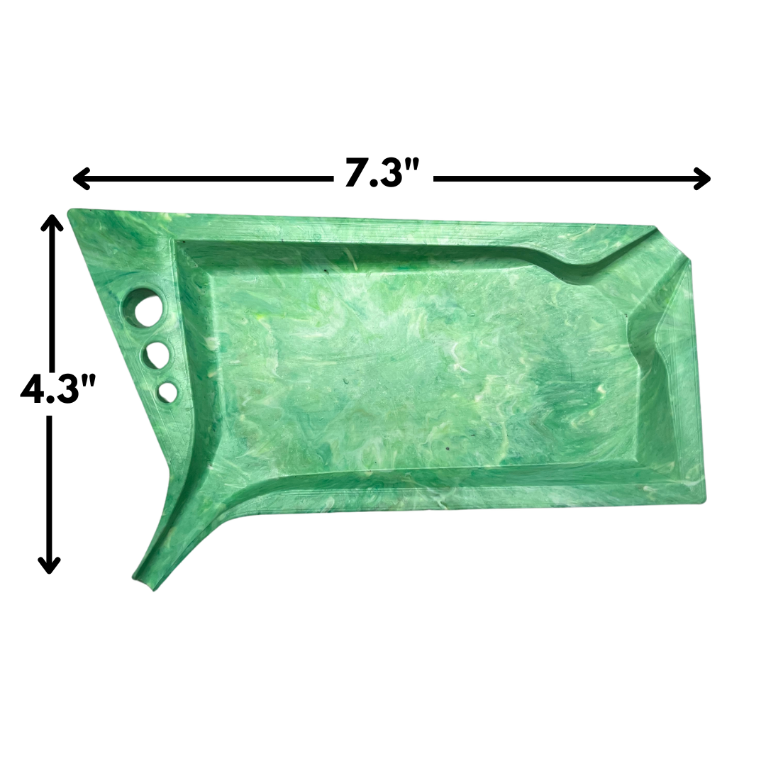 A green marbled rectangular tray with rounded corners, three circular cutouts on one side, and black dimension arrows showing 7.3 inches wide and 4.